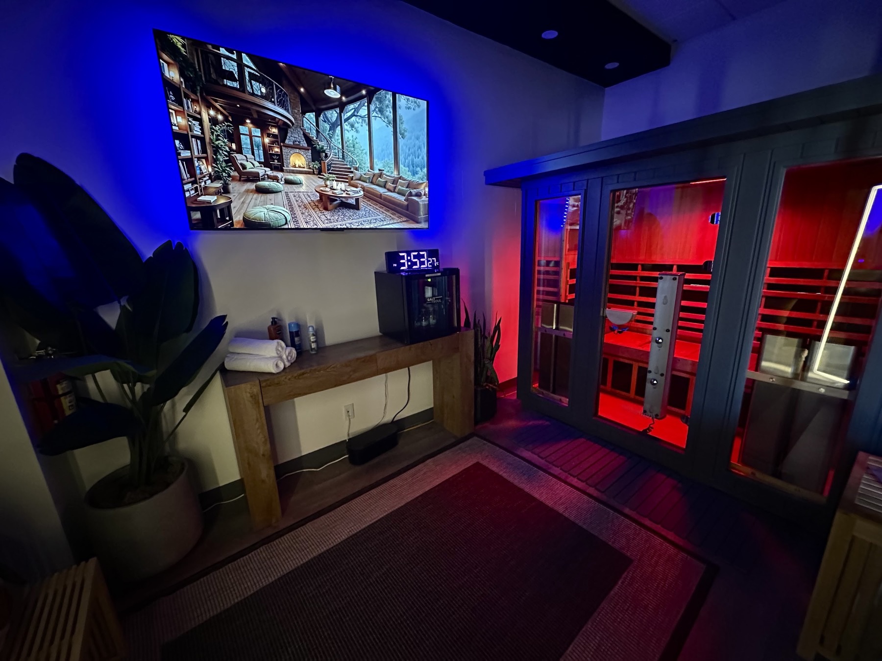 A private Sauna House suite in Dallas with the infrared cabin lit from within